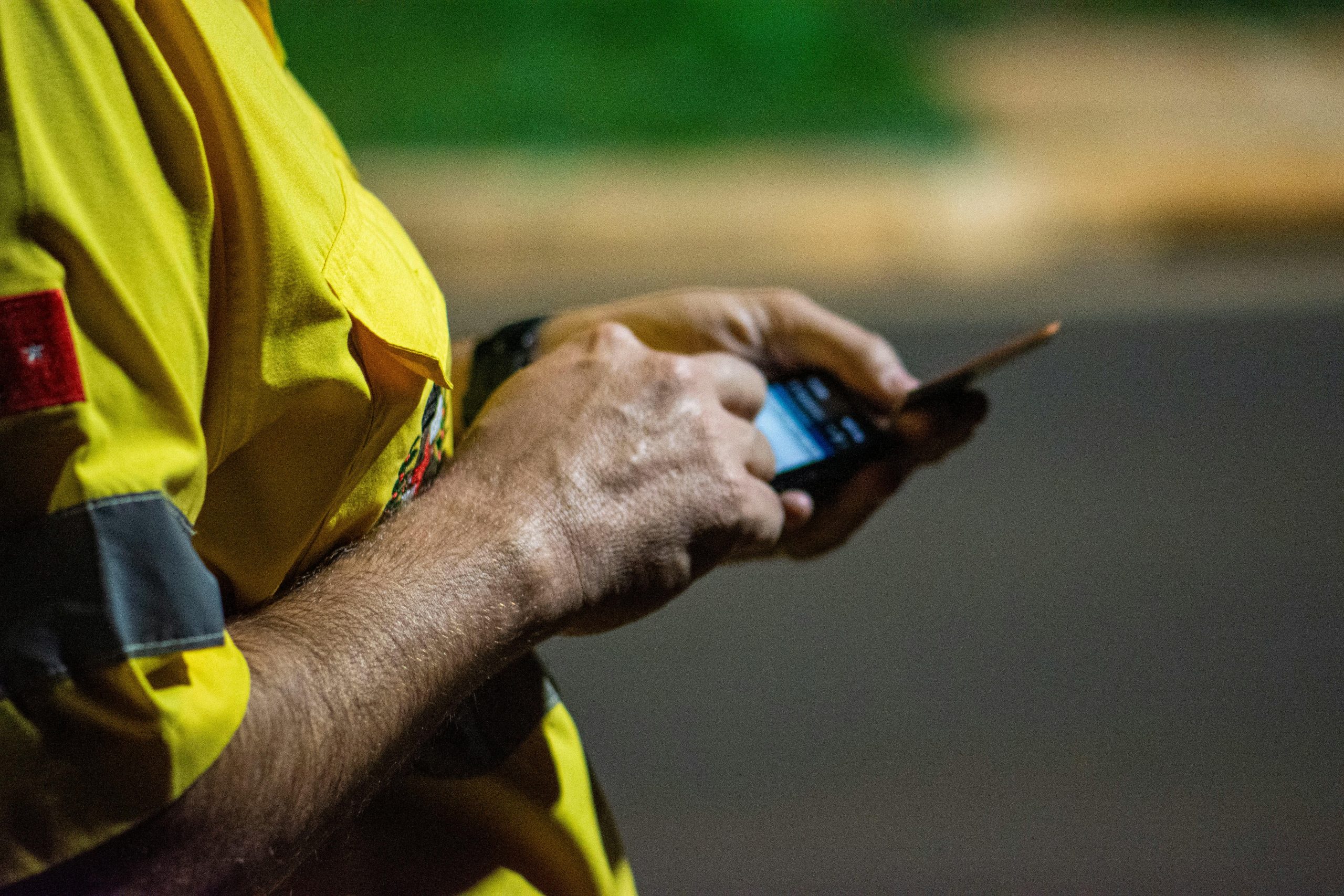 SEO for tradies Western Sydney — tradie searching Google on smartphone